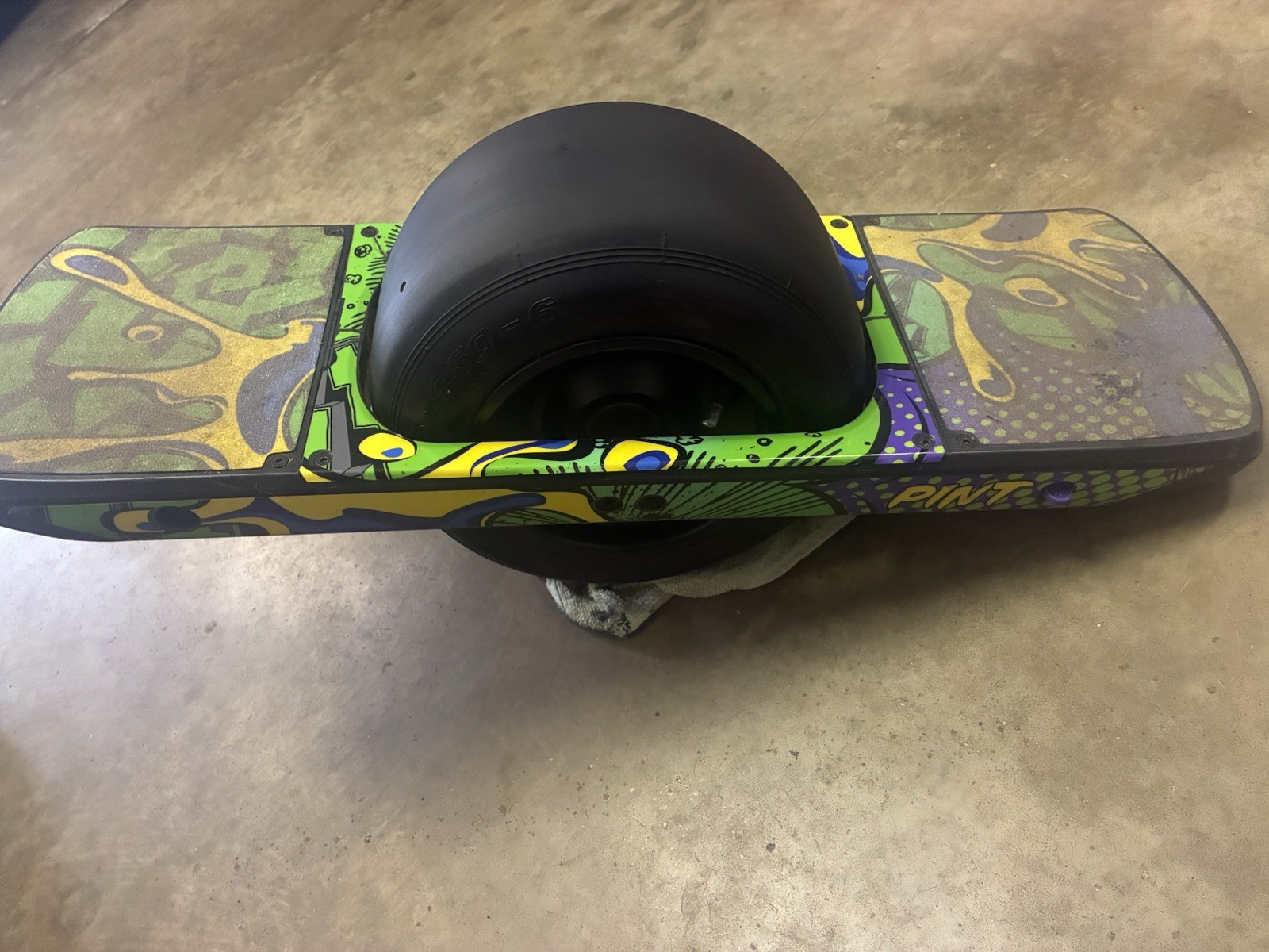 Working low mileage Onewheel Pint with custom Green Rails wrap