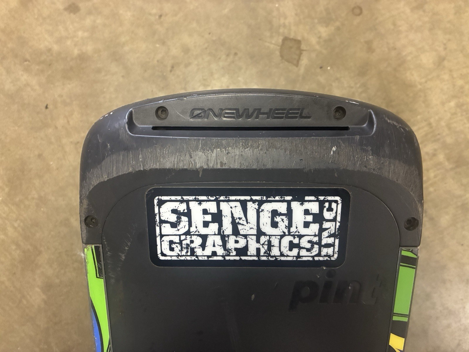 Working low mileage Onewheel Pint with custom Green Rails wrap