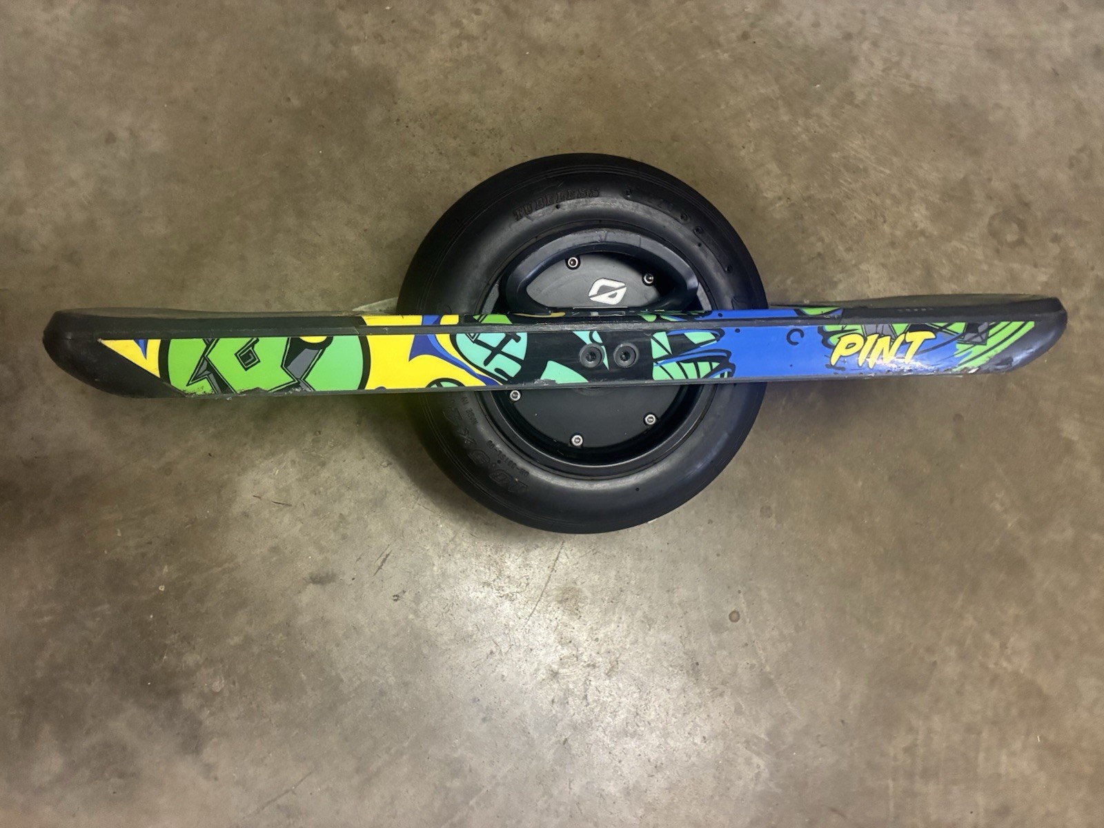 Working low mileage Onewheel Pint with custom Green Rails wrap