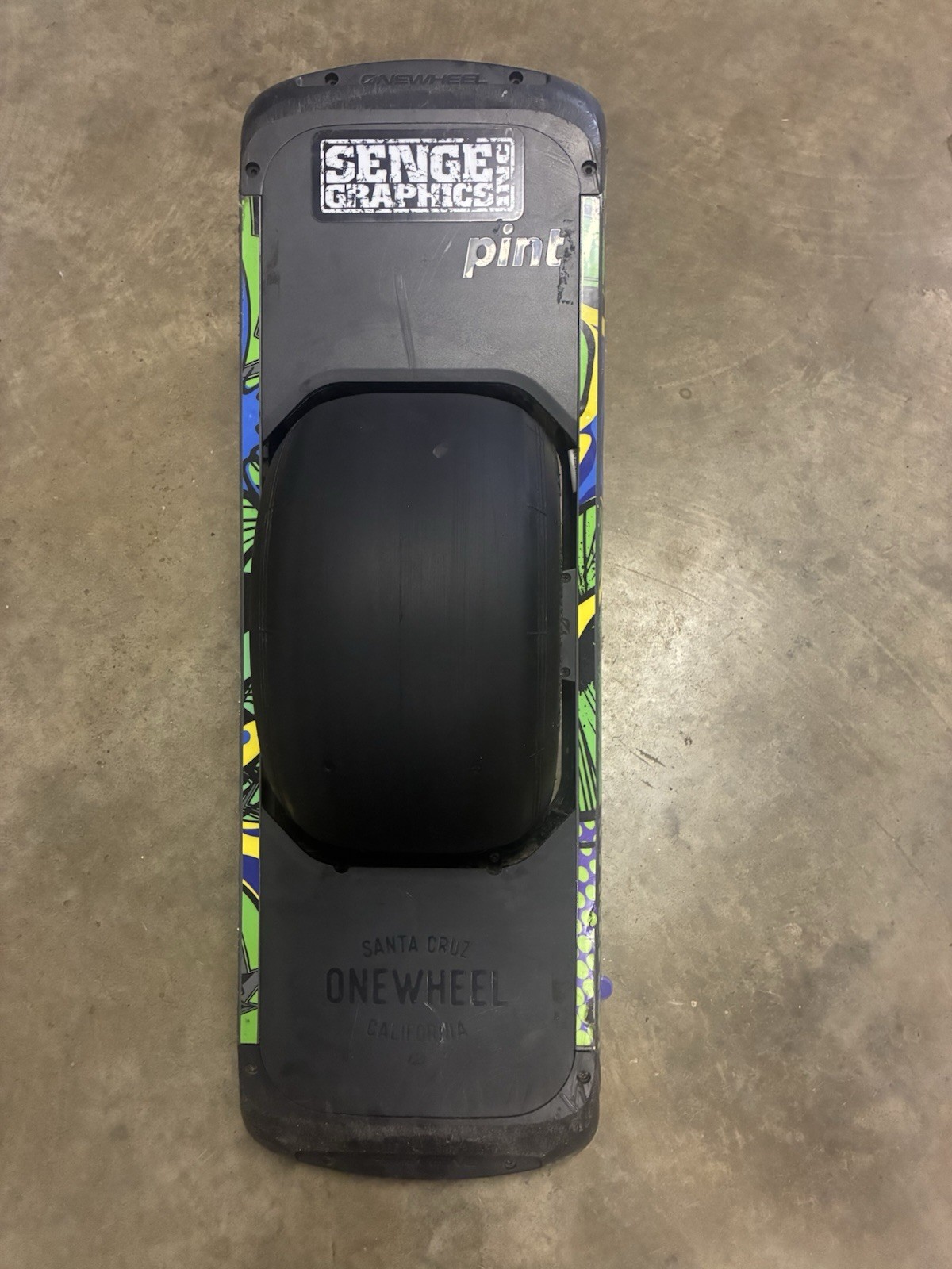 Working low mileage Onewheel Pint with custom Green Rails wrap